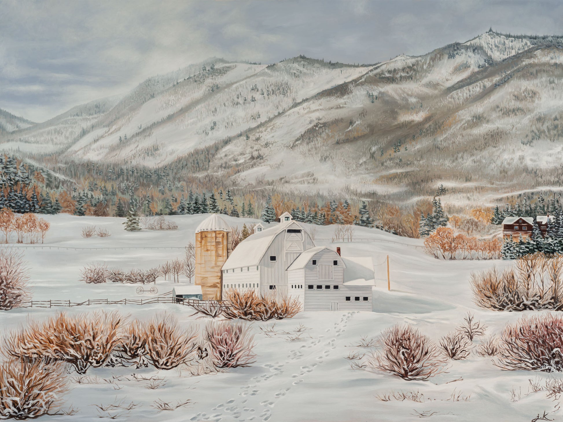 Winter landscape with a barn, silo, and snow-covered mountains.